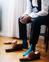Detalle medias de compresión para hombre al muslo