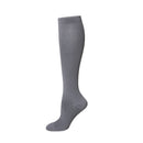 Medias de compresión color gris a la rodilla con soporte graduado